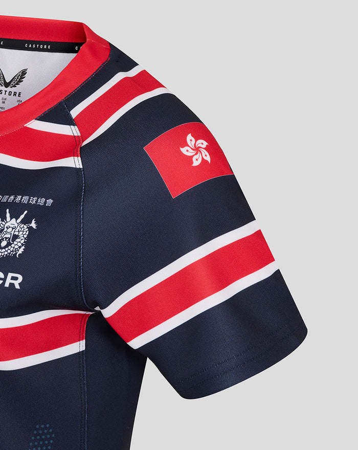 Sleeve close-up of HKCR Home 15s jersey showing Hong Kong flag patch and red white stripe pattern.