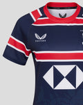 Close-up of front upper navy HKCR Home 15s jersey showing Castore logo on left chest red collar and stripes and the large white diamond sponsor.