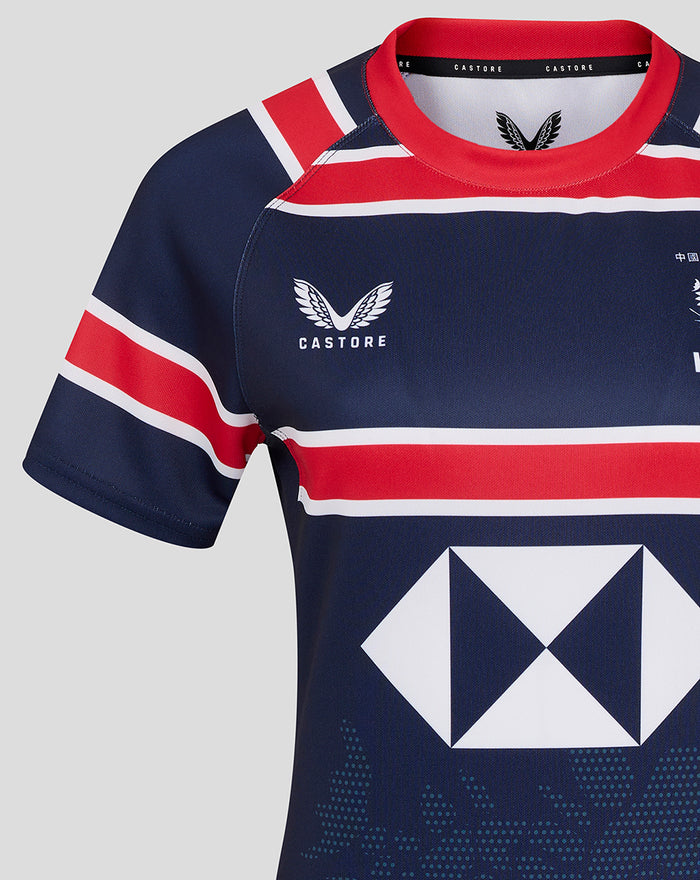 Close-up of front upper navy HKCR Home 15s jersey showing Castore logo on left chest red collar and stripes and the large white diamond sponsor.