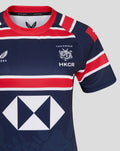 Close-up of navy HKCR Home 15s jersey chest with red white stripes, HKCR crest and Castore logo.