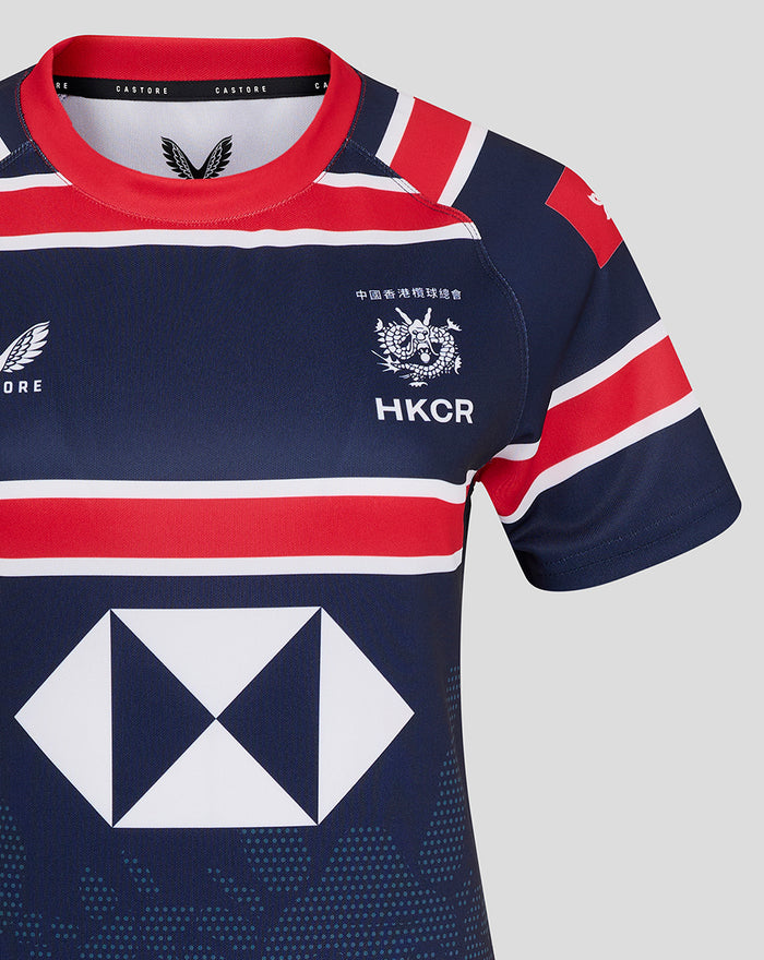 Close-up of navy HKCR Home 15s jersey chest with red white stripes, HKCR crest and Castore logo.