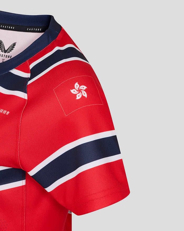 Close up of red HKCR Away 15s jersey sleeve with navy and white stripes and a Hong Kong flag motif patch