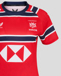 Shoulder and chest closeup of red HKCR Away 15s replica jersey showing team crest and bold navy white stripes
