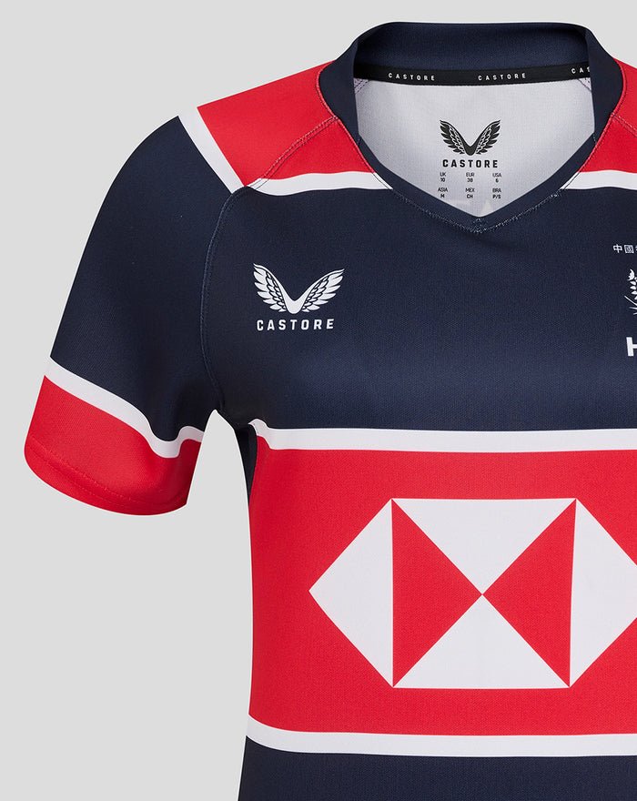 Close up of the back collar area of the navy jersey with Castore branding and red sleeve trim