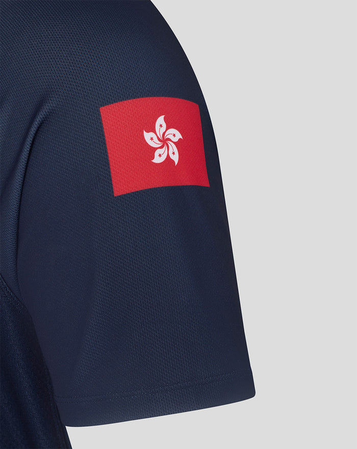 Close up of navy jersey hem showing Castore authentic product patch with wings emblem