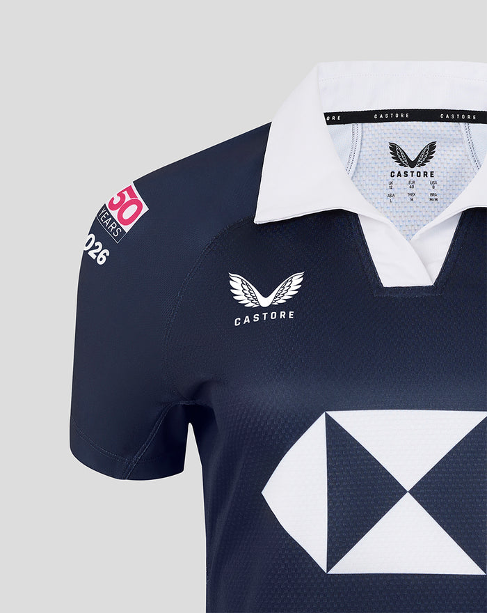 Close-up of navy Hong Kong Sevens home replica jersey with white collar dragon crest and large white diamond logo.