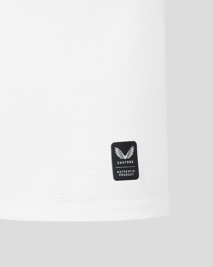 White jersey sleeve with a small black Castore authentic product badge