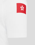 White jersey sleeve featuring a red patch flag with a white hibiscus emblem