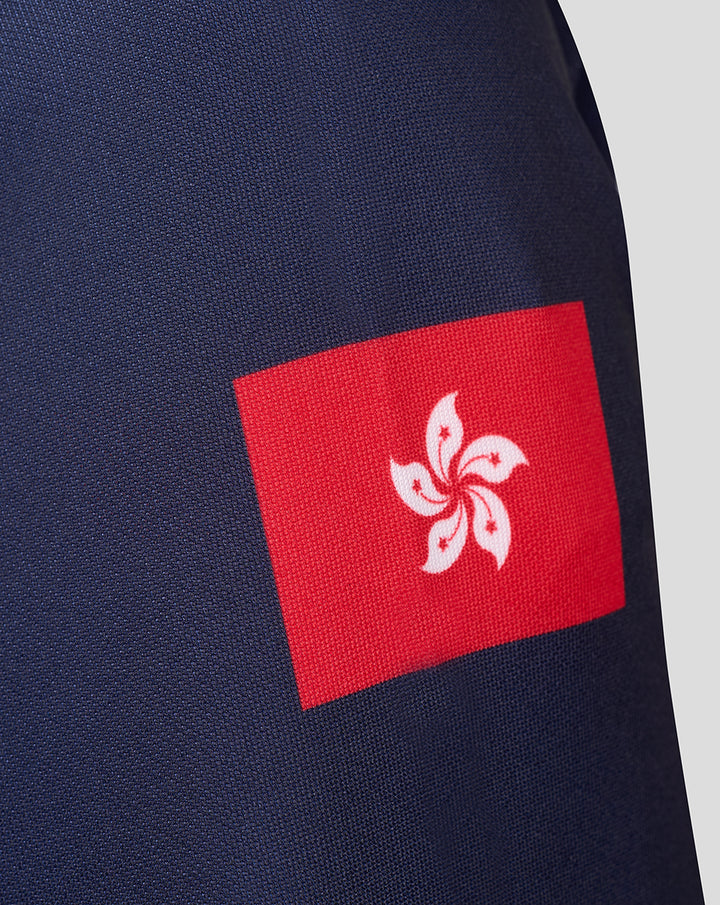 Close up of a red Hong Kong flag patch with white flower on navy fabric of the jersey