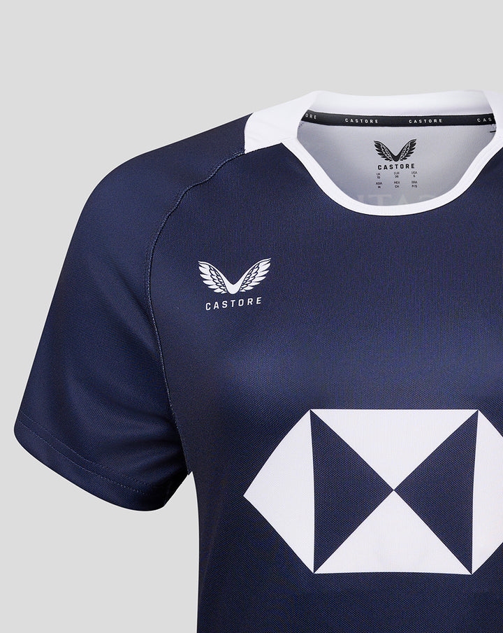 Navy women's home jersey with white collar, winged CASTORE crest on chest and a large white diamond logo on the front
