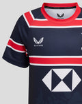 Close-up of the front upper chest of the navy HKCR Home 15s jersey showing red collar, Castore branding at the neck and HKCR crest on the chest.