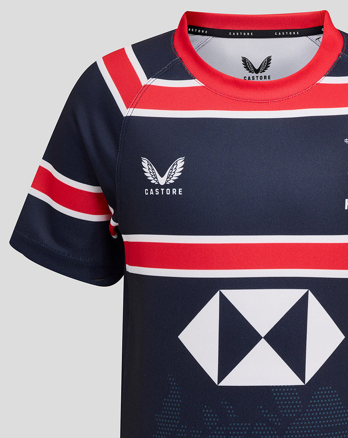 Close-up of the front upper chest of the navy HKCR Home 15s jersey showing red collar, Castore branding at the neck and HKCR crest on the chest.