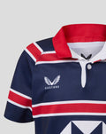 Close up of the HKCR Home jersey neck showing navy fabric red collar and white placket.