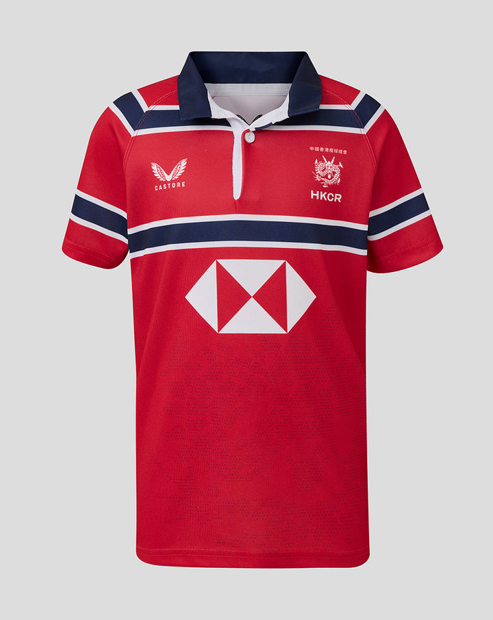 Red away rugby jersey with navy collar white placket and Castore logo beside HKCR crest