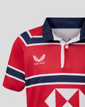 Red and navy HKCR away jersey close up showing Castore wing logo and bold chest stripes.