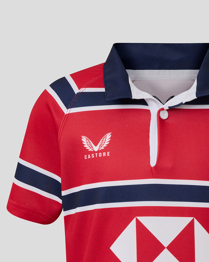 Red and navy HKCR away jersey close up showing Castore wing logo and bold chest stripes.