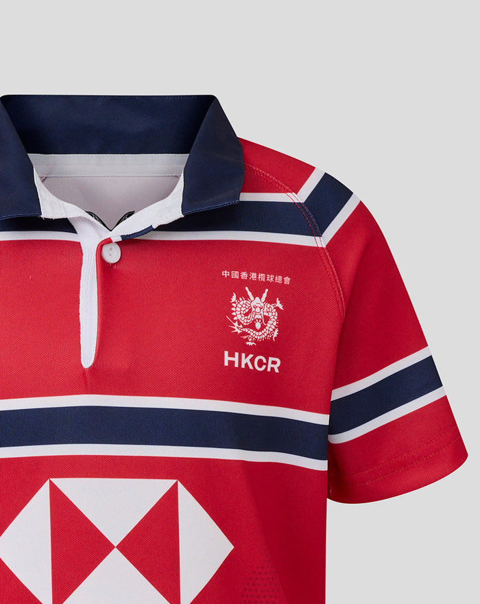 Chest of red HKCR away jersey with white crest and HKCR lettering.