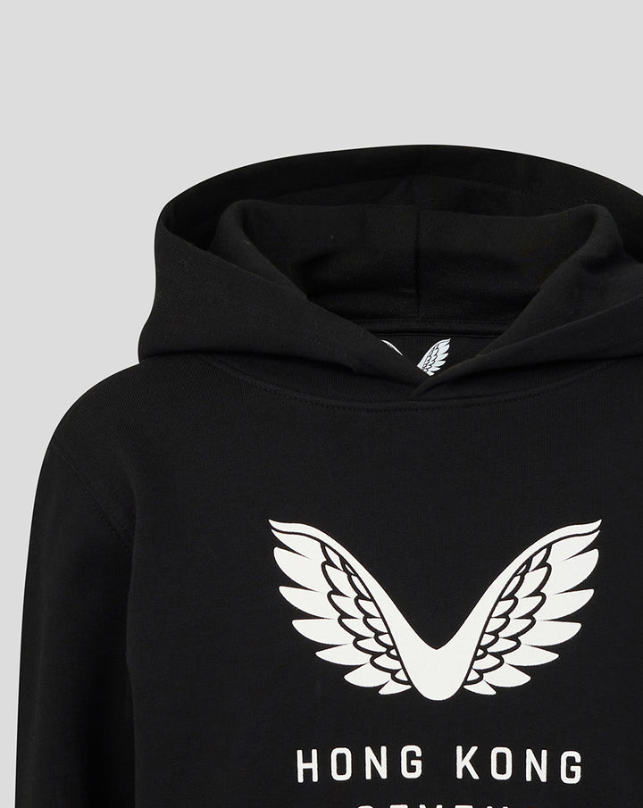 Close-up of the white wings logo on the chest of a black Junior HK7s Hoodie