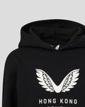 Close-up of the white wings logo on the chest of a black Junior HK7s Hoodie