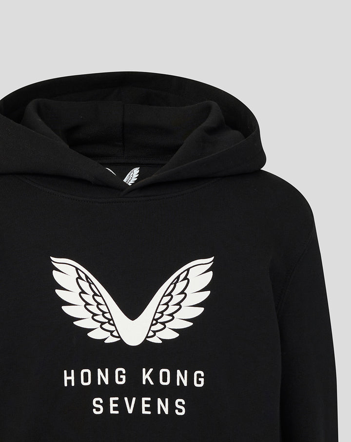 Detail of the large white wings emblem on the chest of the black Junior HK7s Hoodie