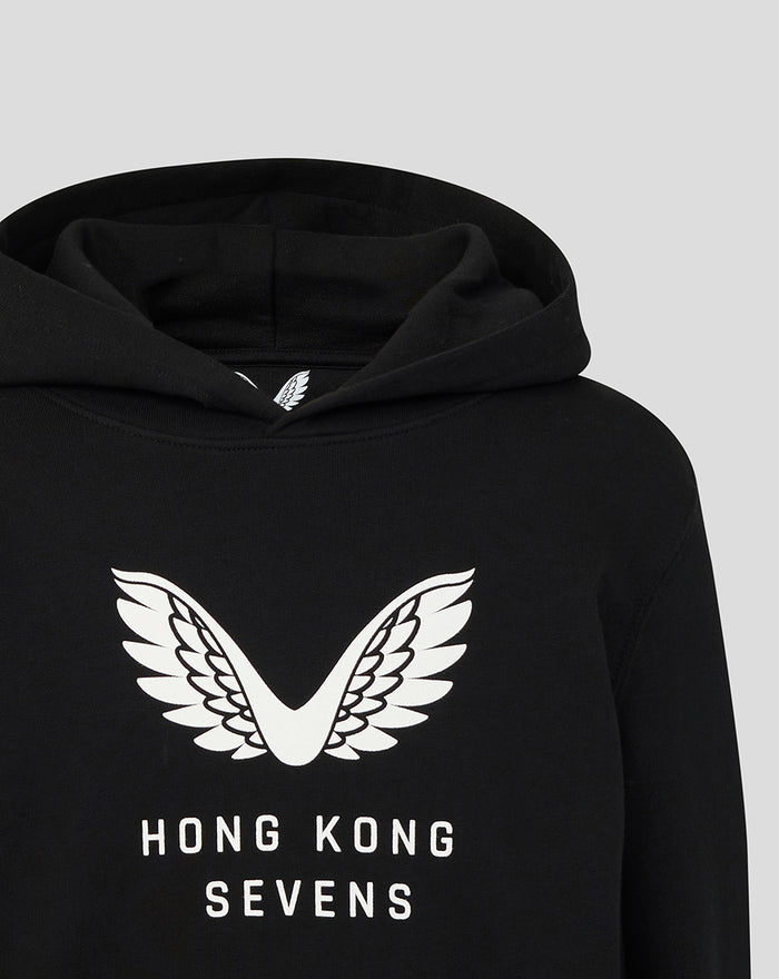 Detail of the large white wings emblem on the chest of the black Junior HK7s Hoodie