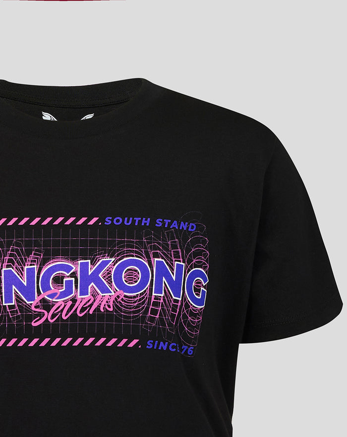 Close up featuring the Hong Kong Sevens graphic on the black tee with pink stripes and grid background
