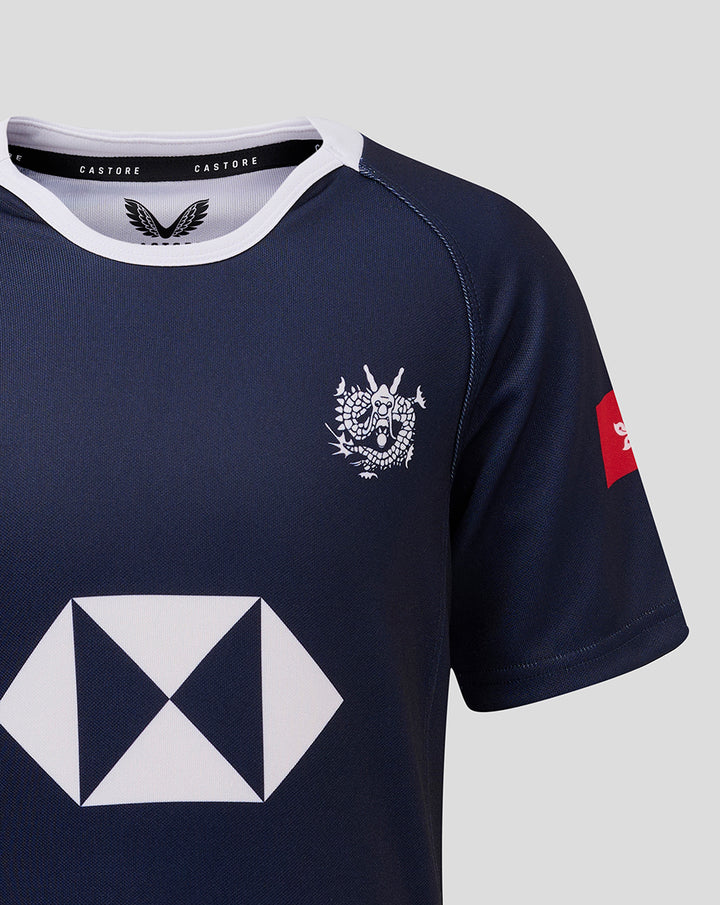 Navy jersey upper torso with a small white chest crest and a red patch on the sleeve
