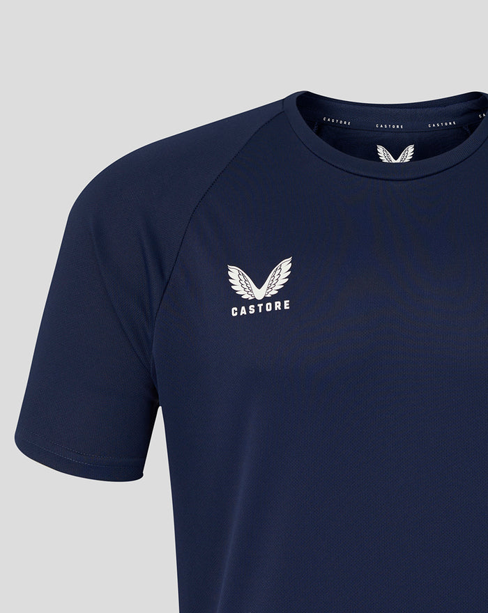 Close up of navy men's short sleeve training tee showing the Castore logo and the HKCR crest on the chest