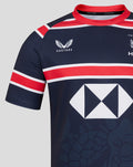 Close up of navy jersey showing Castore logo on left chest HKCR crest on right chest and the large diamond sponsor across the torso.