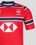Close up of red HKCR Away 15s replica rugby jersey showing crest and white diamond sponsor logo with navy stripes