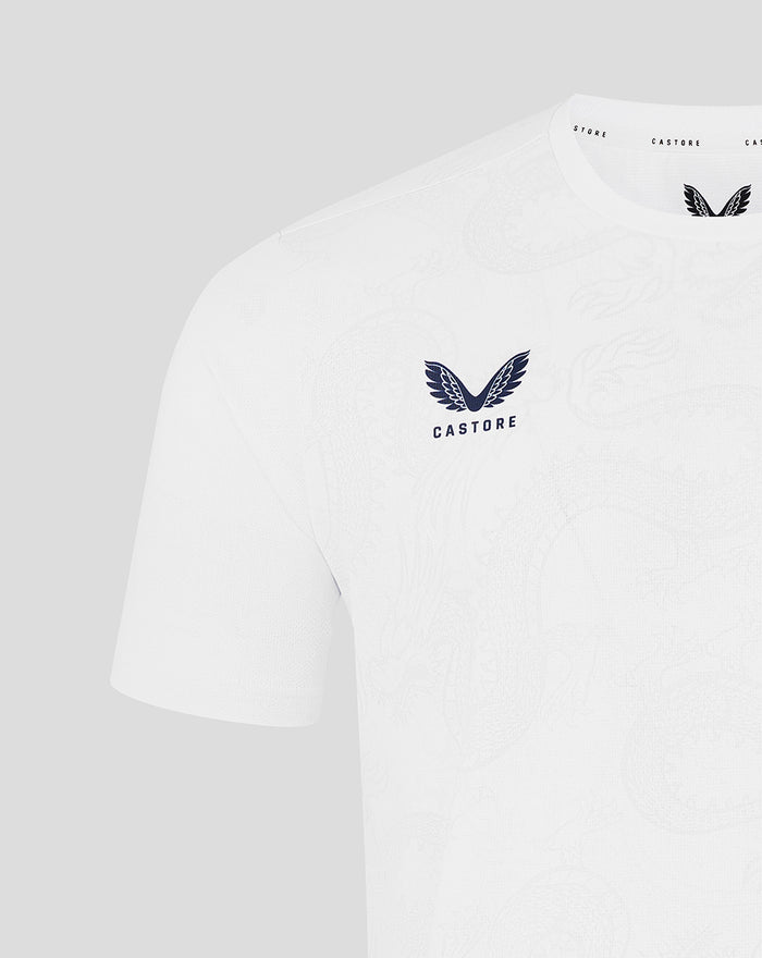 White graphic training tee with navy winged logo on the chest and subtle jacquard texture
