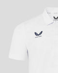 Close up of the white polo front showing the Castore logo on the chest and the HKCR crest on the opposite side.