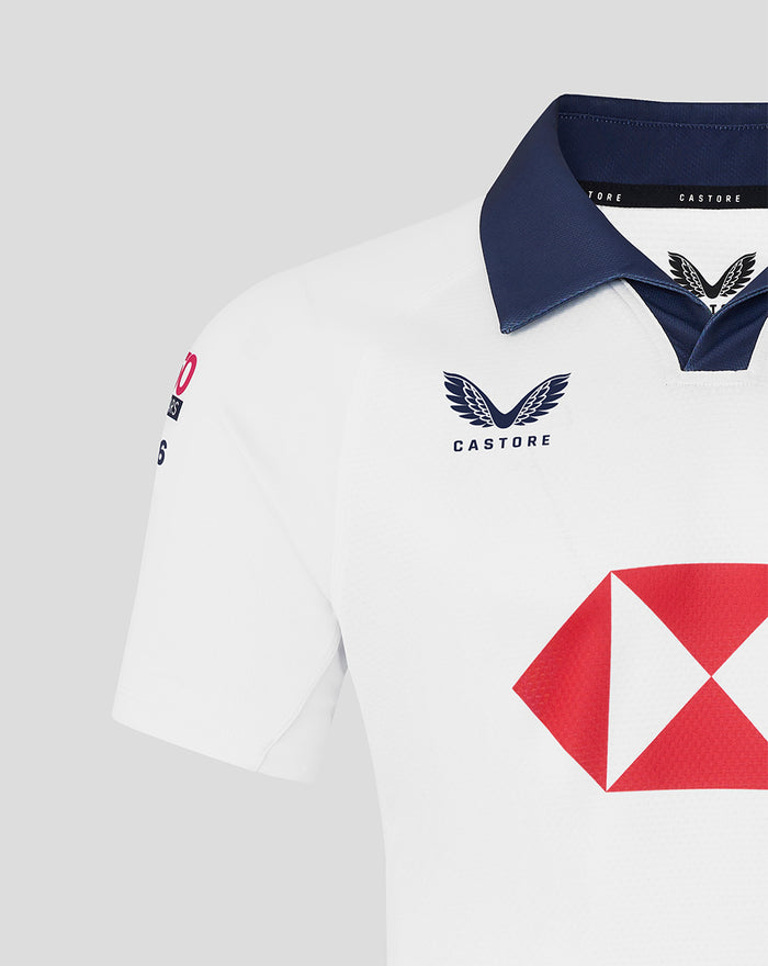 Close-up of white away rugby jersey with navy collar, Castore branding, and bold red HSBC diamond logo on the front.