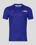 Front view of blue graphic training tee with tonal dragon pattern and 50 years patch