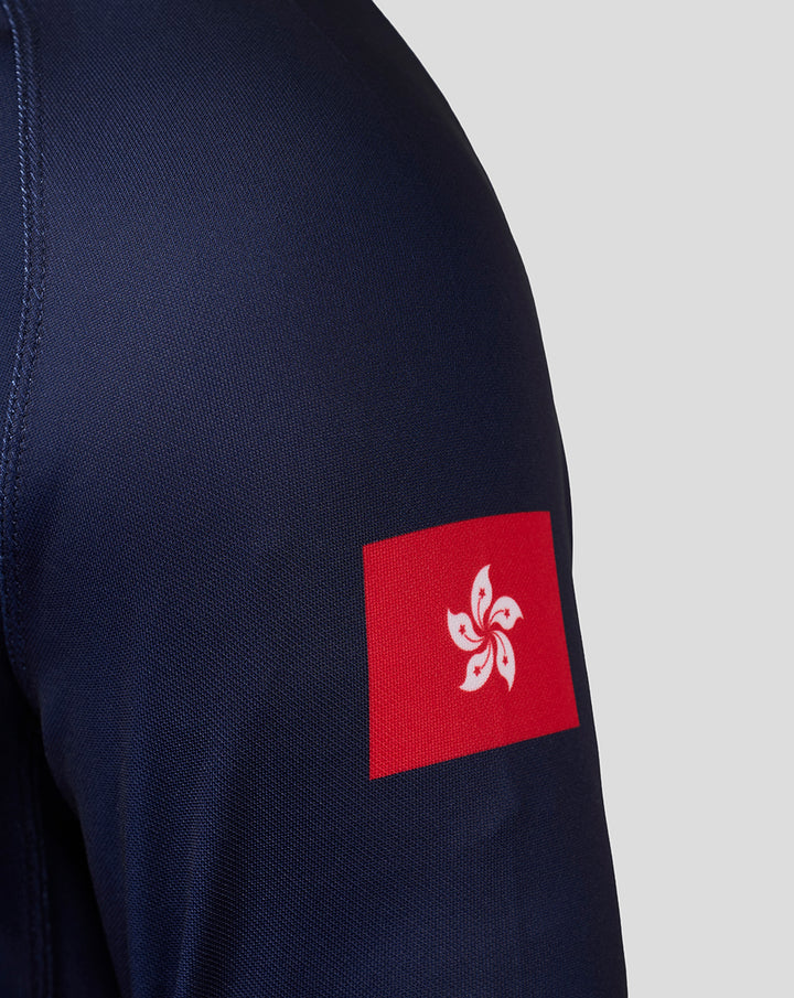 Navy jersey sleeve with a red square patch showing a white Bauhinia flower emblem from the Hong Kong flag.