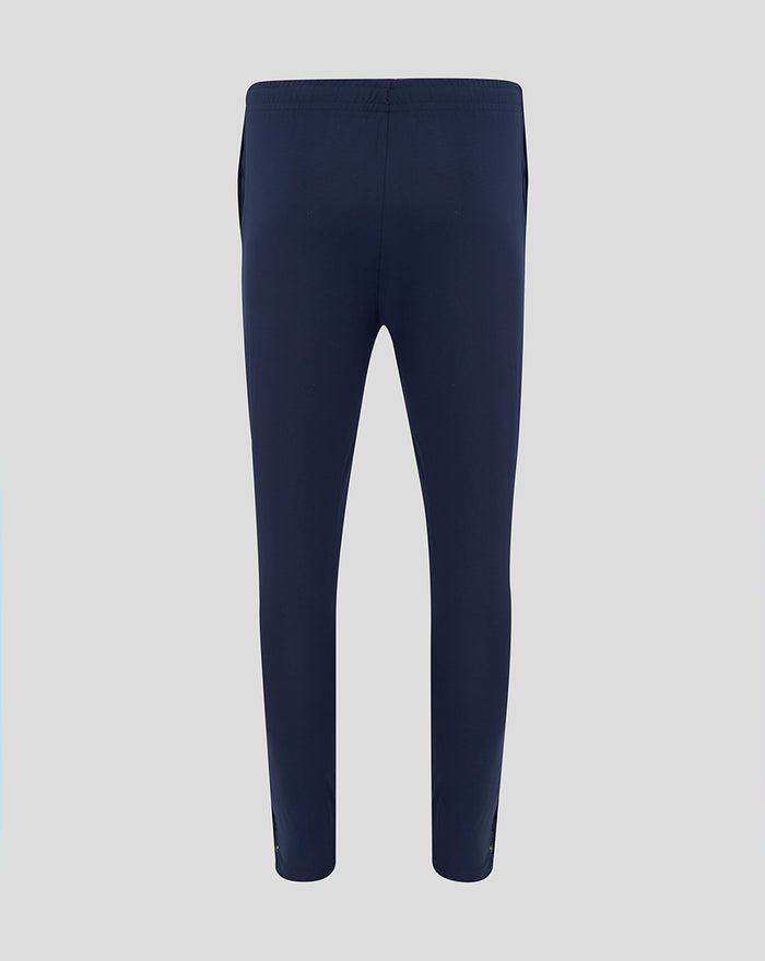 Back view of navy HKCR slim fit pants with an elastic waistband.