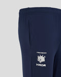 Close-up of navy HKCR slim fit pants showing elastic waistband and white crest logo with Chinese characters.