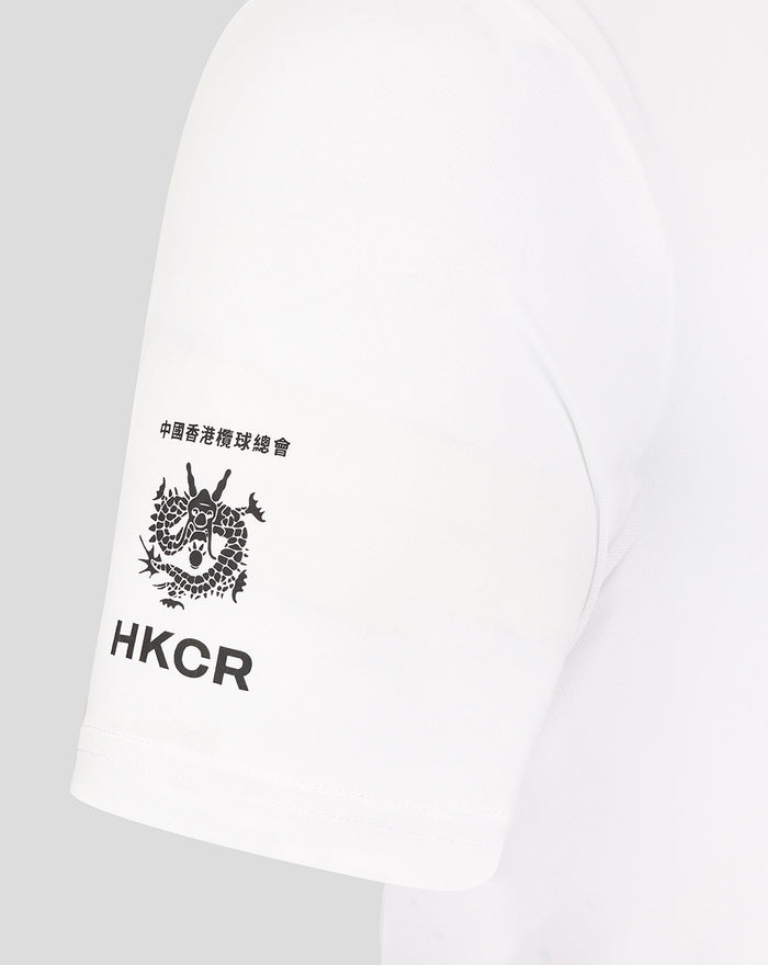 Close up of sleeve showing HKCR logo and dragon emblem on white rugby tee.