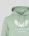 Aloe green unisex hoodie close-up shows oversized white wings graphic and Hong Kong Sevens text on the chest.